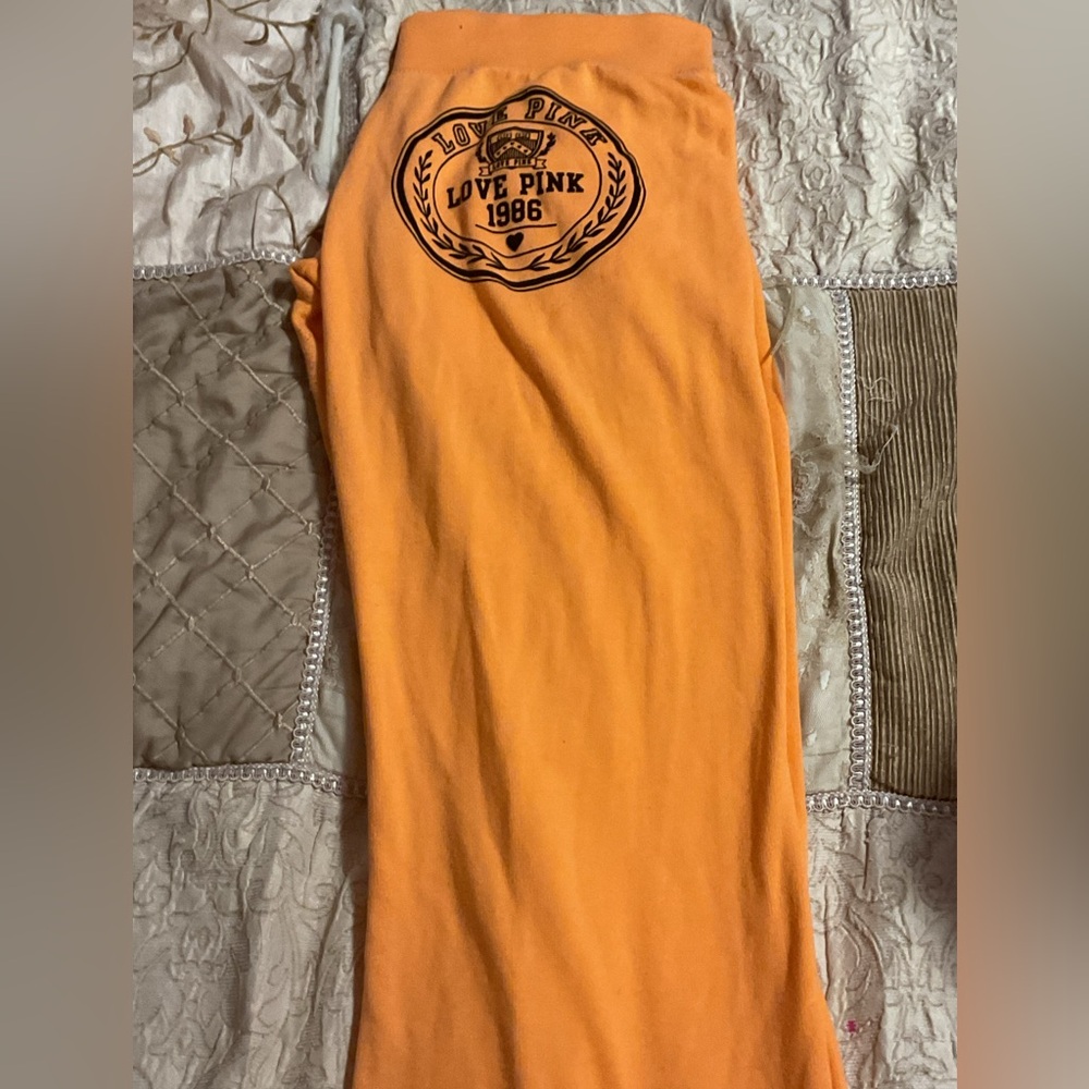 Pink orange sweat pants there a LARGE and only worn  once and it comes washed